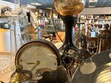 a large collection of antique items on display in a store
