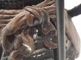 a close up of a statue of a person holding a sword