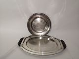 a silver tray with a silver plate on top of it