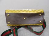 guccissi wallet purse with gold hardware and green and red ribbon