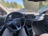 the interior of a car with a steering wheel and dashboard controls