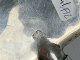 a close up of a metal object with a sticker on it