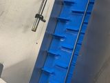an image of a staircase with a blue handrail