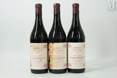 three bottles of wine sitting on top of a white table