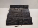 a black keyboard that is sitting on a white table