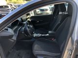 the interior of a car with the door open and the driver ' s seat down