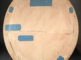 a picture of a plate with blue paint on it