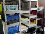 a room that has a lot of shelves and bins in it