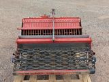 a truck bed that is sitting on a pallet in the dirt