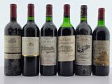 plusieurs bouteilles de vin sont alignées sur une table