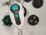 a white and black device with a blue button on it