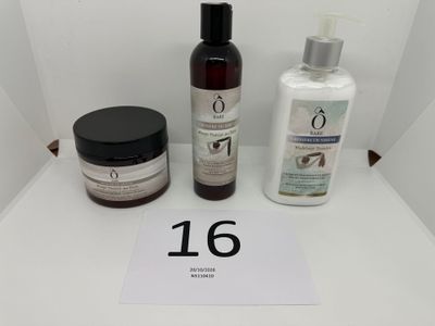 two bottles of lotion and a bottle of lotion sitting on a table