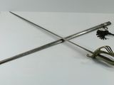 two swords that are sitting on a table