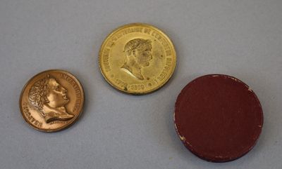 three different types of coins are shown on a white surface