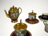 three cups and a saucer on the table