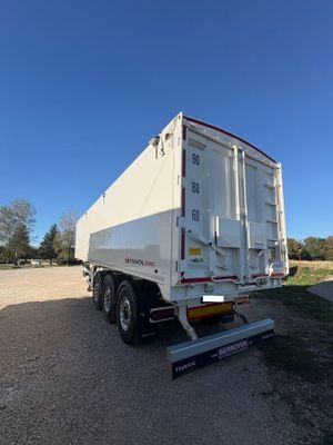 an image of a white semi truck parked in a lot