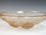 a glass bowl that is sitting on a table