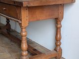 a wooden table with a drawer on top of it
