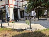 two umbrellas that are sitting outside of a building