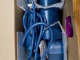 a cardboard box with a bunch of electrical cords in it