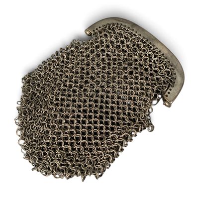 chain mail bag on a white background with clippings on it