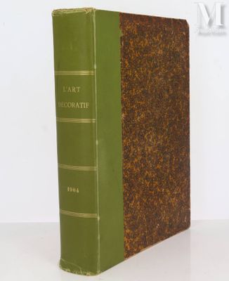 an old book sitting on top of a table next to a white wall