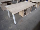 several desks and chairs in a room with a lot of wood