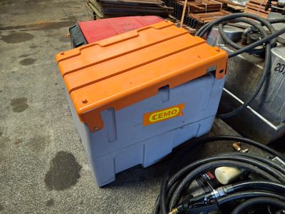 an orange and blue box sitting on the ground