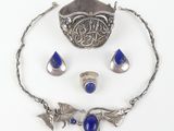 an image of a silver and lapis stone jewelry set