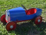 a toy car that is sitting in the grass