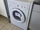 a washer and a dryer in a small kitchen