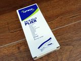 a box of toothpaste on a wooden floor