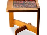 an image of a small wooden table with a tile top on it