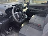 the interior of a small car with a steering wheel and dashboard