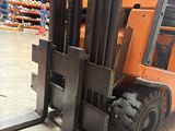 a forklift truck that is parked in a warehouse