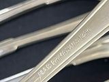 a lot of spoons that are sitting on a table