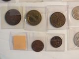 a lot of coins that are in a display case