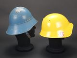 two helmets that are sitting next to each other