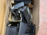 a cardboard box full of electronics and other items