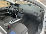 the interior of a car with the door open showing the steering wheel and dashboard