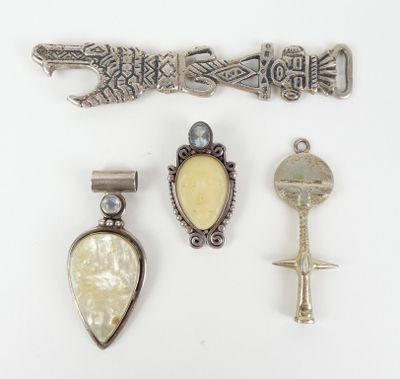 three silver and mother of pearl brooches and a silver and mother of pearl brooch