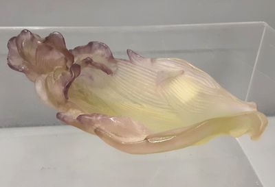 a glass bowl that has a flower inside of it