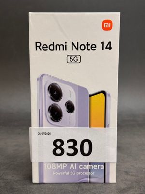 a box of redmi note 14 is shown on a table