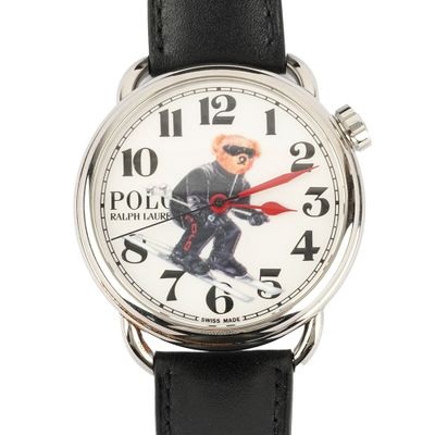 a close up of a wrist watch with a bear on it