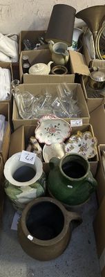 many boxes of different types of pottery on the floor