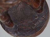 an image of a close up of a bronze statue of a man