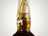an image of a bottle of alcohol sitting on top of a table
