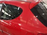 a red car that is parked in a garage