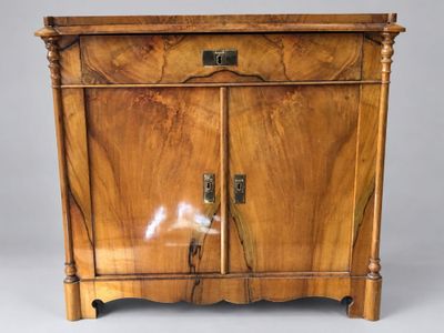 an image of a wooden cabinet with a door and a handle