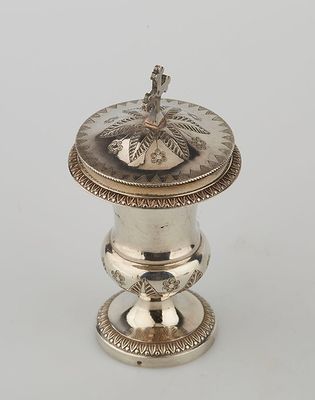 a silverplated incense box with a lid and stand